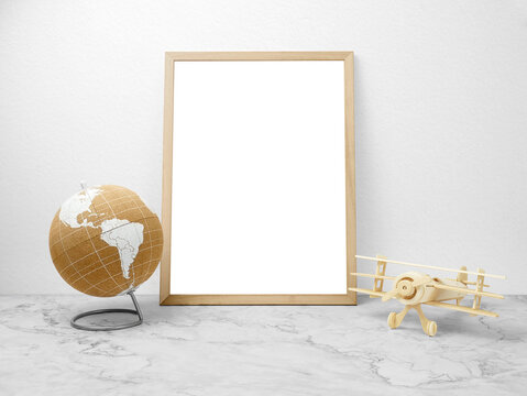 Blank frames mockup on marble floor with world and wooden plane