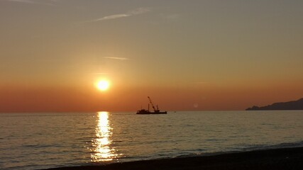 Fototapeta premium boat at sunset