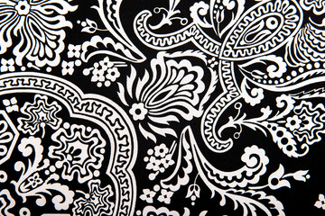 Seamless vintage abstract white floral pattern on black textiles fabric, retro background