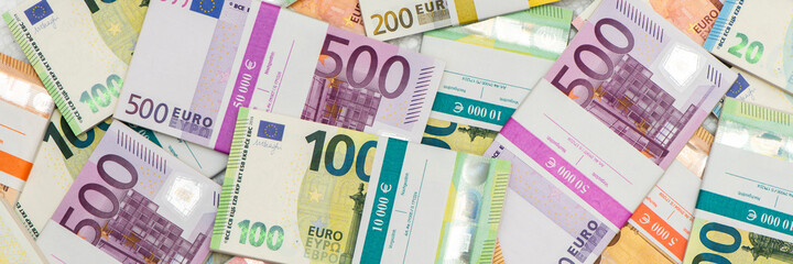 bundles of many Euro banknotes