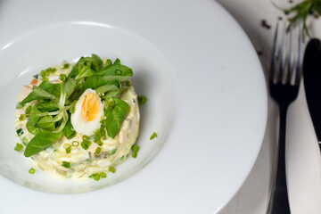 Olivier salad with microgin and quail egg

