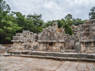 Fototapeta premium Ruins of small bath in ancient Phaselis city. Famous architectural landmark, Turkey.