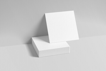 Square business card mockup on gray background. 