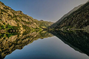 Spectacular reflections in the Estany de Cavallers of the Vall de Boí