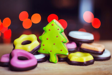 Christmas homemade gingerbread cookies on bokeh lights background 