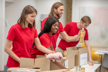 Young people working in a donations distribution center