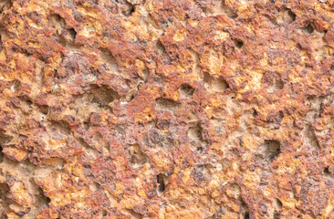blur of red laterite brick wall Porous and fine-grained Background pattern