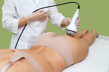 RF lifting in the cosmetology room for cellulite treatment