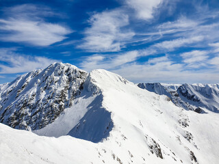 Fototapeta na wymiar snow covered mountains, viewpoint to Buteanu Peak, Fagaras Mountains, Romania 