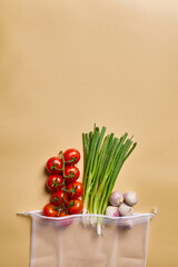 fresh vegetables in a reusable eco-friendly cotton bag