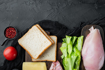 Club sandwich with fresh ingredients, on black background, top view with copy space for text