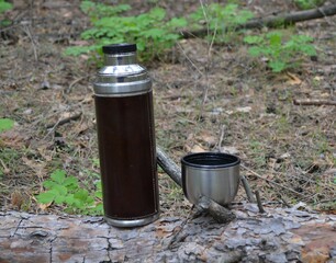 Thermos for tea and a mug.
