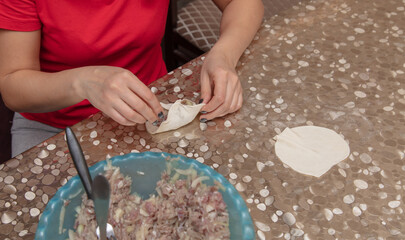 The girl sculpts pies from dough © schankz