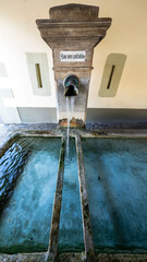 Traditional Swiss water fountain. These fountains used to be the only source of fresh water in villages and thus the center of social life.