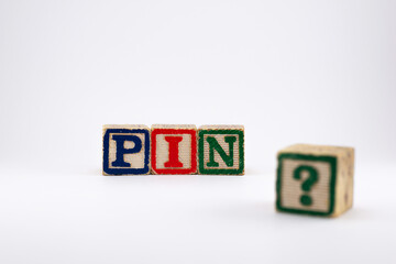 Pin symbol in wooden cubes