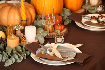 Beautiful autumn place setting and decor on table