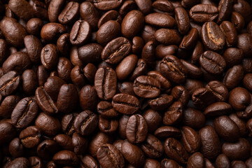 Close up of group black coffee beans. Strong black espresso, Grounds of coffee background, texture