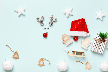 Christmas deer and Santa with a gift on a blue background. Abstraction concept