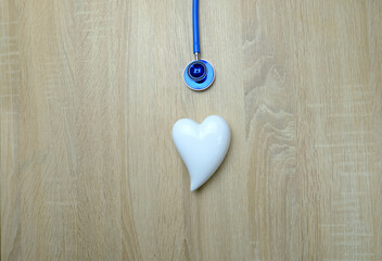 Doctors Work Desk In Hospital With medical stethoscope, model heart,, concept of maintaining...