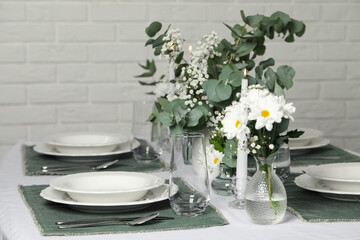 Elegant festive setting with floral decor on table