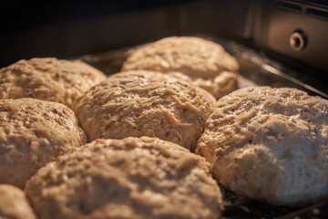 Small loaves of bread leavened on tin. Selective focus