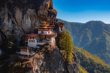 Paro Taktsang or the Tiger's Nest is one of Bhutan's most iconic tourist attractions and is one of only 13 such 'tiger's nests caves' spread throughout Tibet and the Himalayas - obrazy, fototapety, plakaty