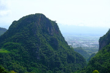 High mountain view, cloudy, distant city