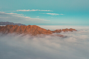 sunset in the mountains with clouds