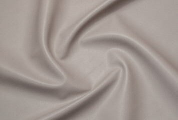 gray artificial leather with waves and folds on PVC base