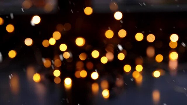 holidays and celebration concept - blurred christmas lights on window sill over snow
