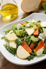 Delicious turnip salad served on table, closeup