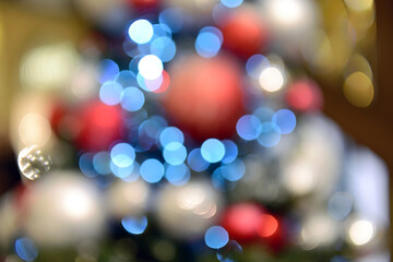 Obraz na płótnie Canvas Blurry New Year and Christmas lights and Christmas toys