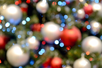 Obraz na płótnie Canvas Blurry New Year and Christmas lights and Christmas toys