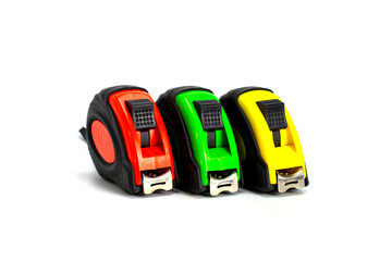 Red, yellow and green tape measure, isolated on white background..