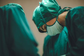 surgeon doctor team working in operation room at hospital, medical health clinic with specialist