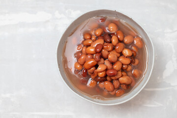 canned food boiled brown beans on bowl