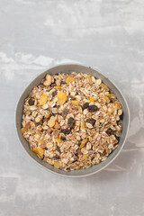 dry muesli with dry fruits in small bowl