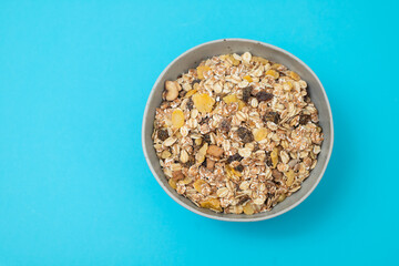 dry muesli with dry fruits in small bowl