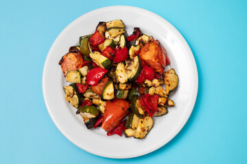 grilled chopped vegetables in white small dish