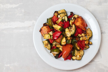 grilled chopped vegetables in white small dish