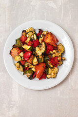 grilled chopped vegetables in white small dish