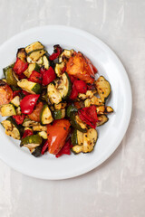 grilled chopped vegetables in white small dish
