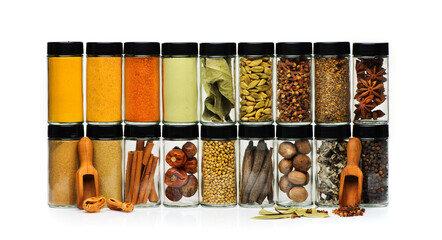 Spices and in glass jars on a white background. Spicy and seasoning banner