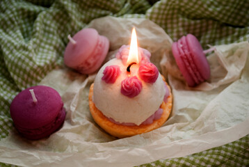 Candles in the form of ice cream dessert and macarons pastries. Handmade Korean style candles. Candle Making.A beautiful candle is burning. Idea for business .