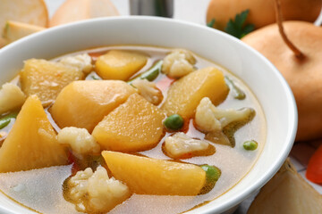 Bowl of delicious turnip soup, closeup view
