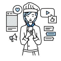 立ってスマートフォンでさまざまなSNSで楽しく交流する調理師の女性