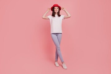 Fototapeta na wymiar Photo of positive charming lady posing wear stylish european french outfit isolated pink color background