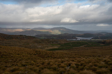 Taken from famous Suidhe viewpoint looking over moorland, lakes and mountains with blue sky and clouds. Scottish Highlands, near Fort Augustus.