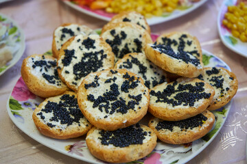 sandwich with caviar,plate with sandwiches and black caviar