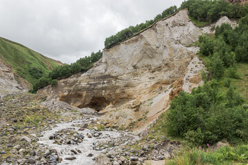 Close-up of a large turbulent flow of water in the river. A mountain river carries its waters...
